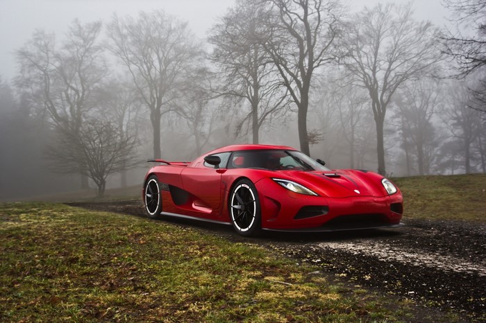 Red Koenigsegg Agera on a foggy forest road