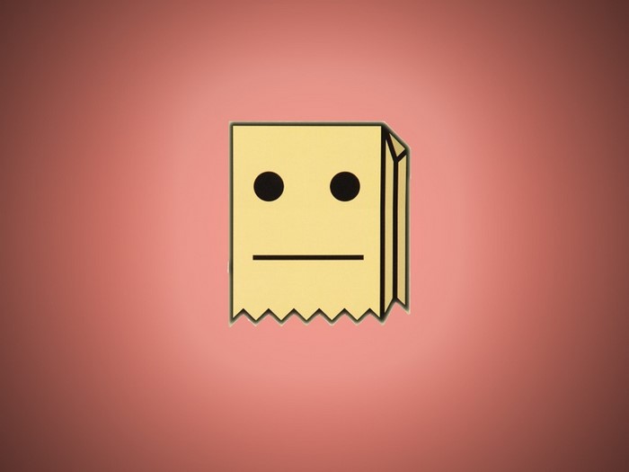 Yellow paper bag character with black eyes and mouth