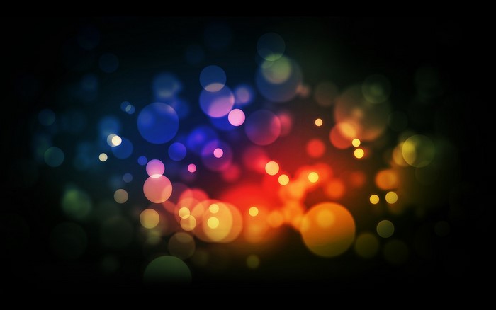 Abstract colorful bokeh lights on a dark background