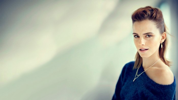 Emma Watson wearing a blue sweater and necklace