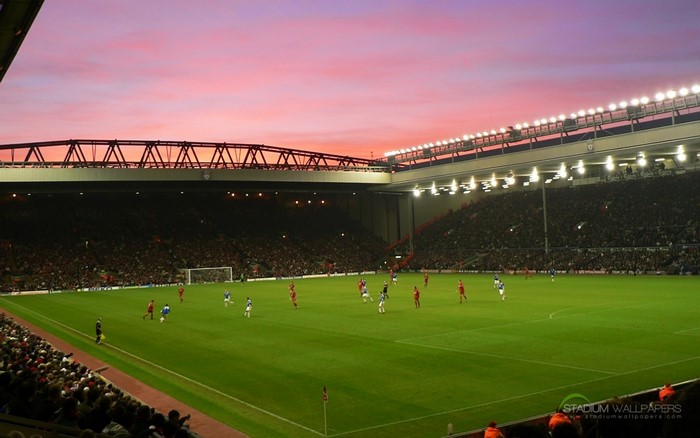 Soccer game at Anfield Stadium during sunset