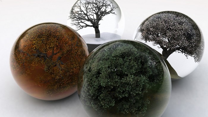 Four spheres with trees representing seasons