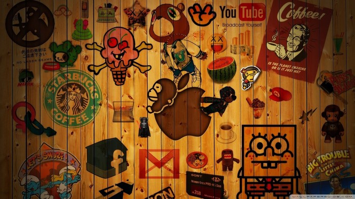 Collage of pop culture logos and characters on wood