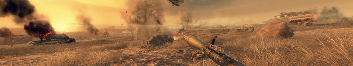 War scene with explosions and burning vehicles