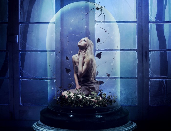 Woman trapped in a glass dome with a spider