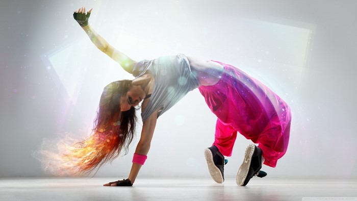 Woman breakdancing with colorful light effects