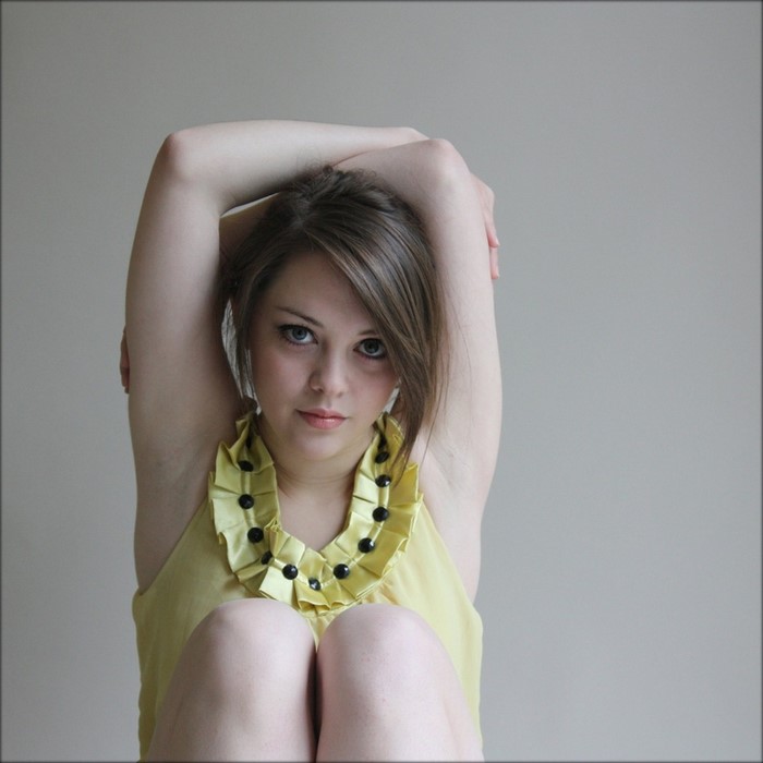 Imogen Dyer portrait with yellow ruffled top