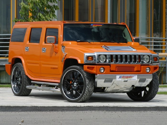 Orange Hummer H2 with custom rims