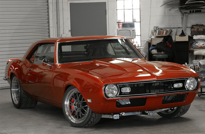 Orange 1967 Chevrolet Camaro Coupe in a garage