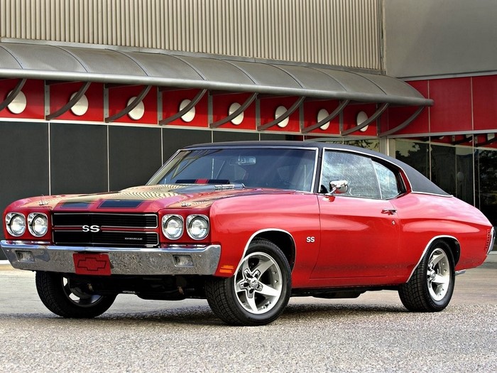 Red Chevrolet Chevelle SS parked in front of a building