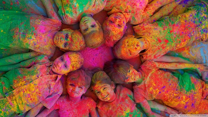 Children covered in colorful powder during Holi festival