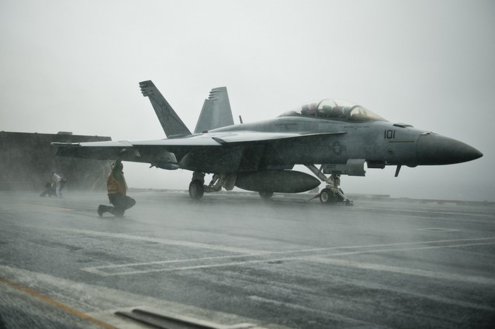 F/A-18E/F Super Hornet on a wet aircraft carrier deck