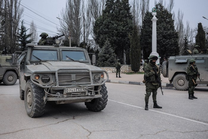 Russian Army vehicles and soldiers on street