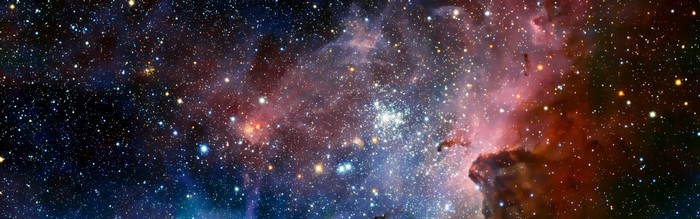 A colorful nebula filled with stars in outer space