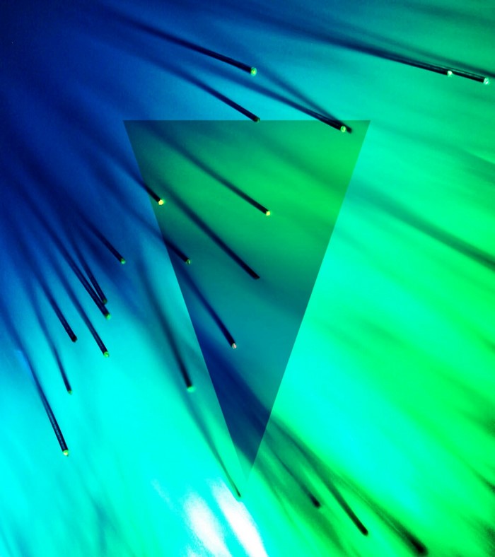 Abstract blue and green light streaks with triangle overlay