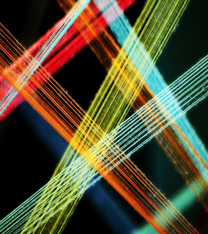 Close up of colorful threads crossing