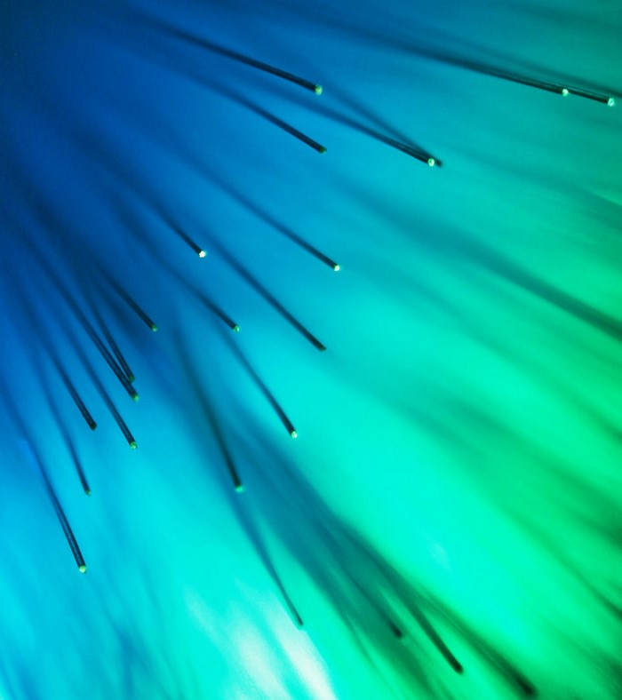 Close up of blue and green optic fibers