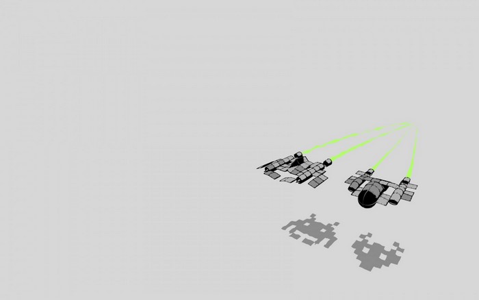 Two spaceships firing green lasers with pixelated shadows