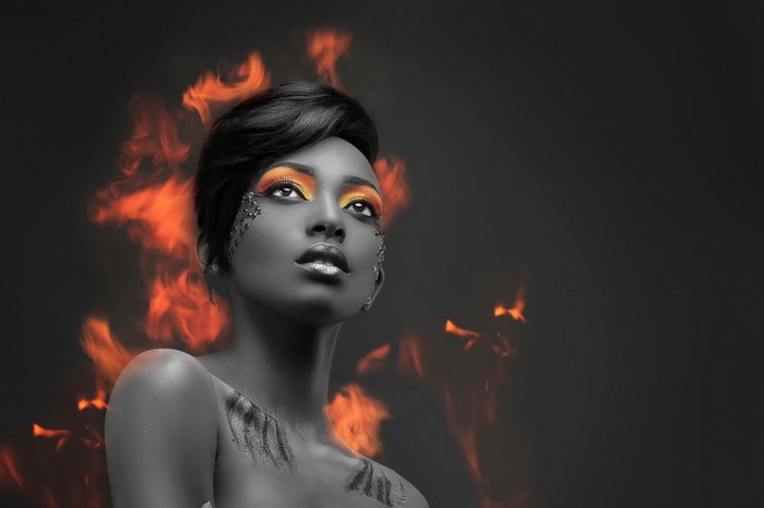 Woman with fiery makeup and flames