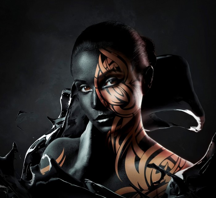 Woman with black and tribal body paint