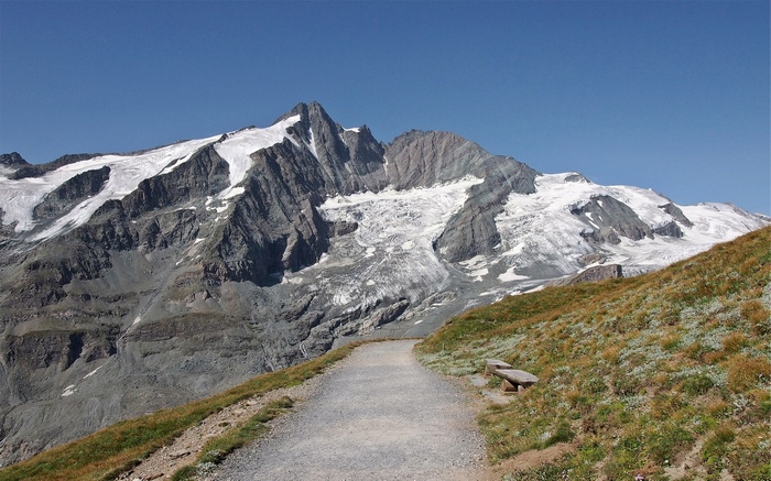 Mountain range with glaciers and a walking path