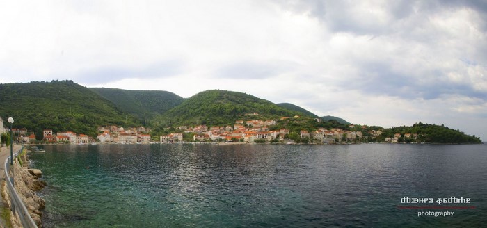 Coastal town in Croatia with green hills and blue water