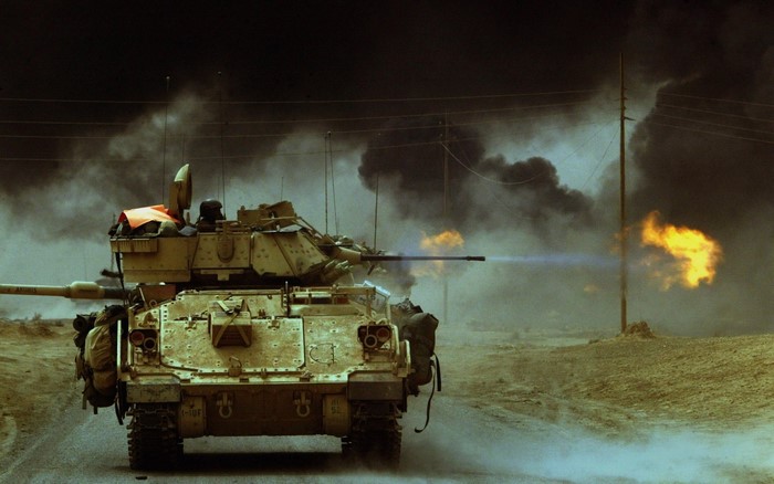 Bradley Fighting Vehicle firing weapon in combat
