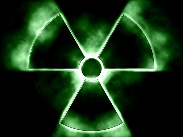 Radioactive symbol with green smoke