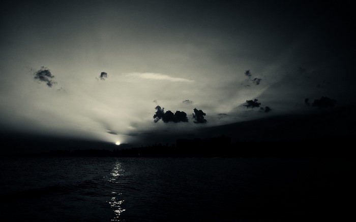 Sunset over the sea with clouds and reflection