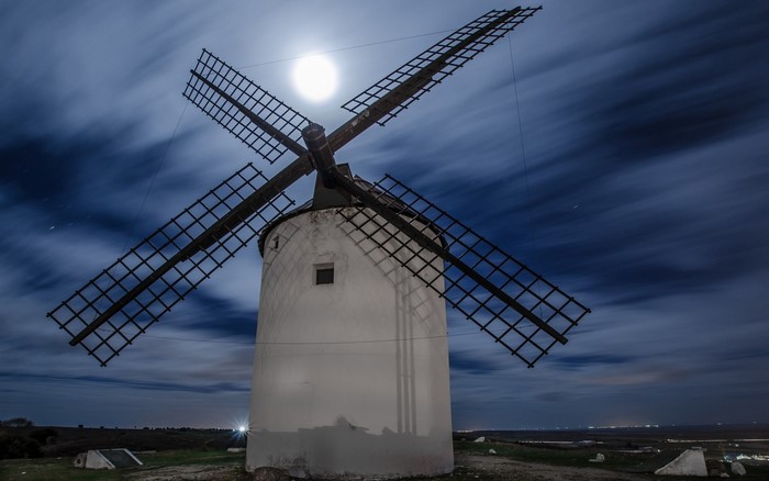Windmill at night with moon and clouds