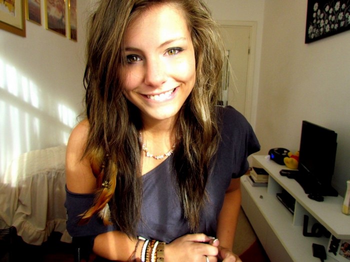 Young woman with brown hair smiling