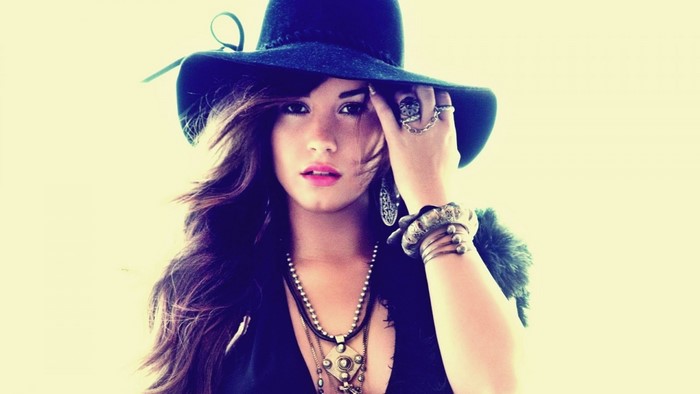 Demi Lovato wearing a hat and jewelry