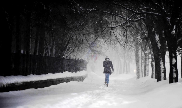Person walking in a snowy winter blizzard
