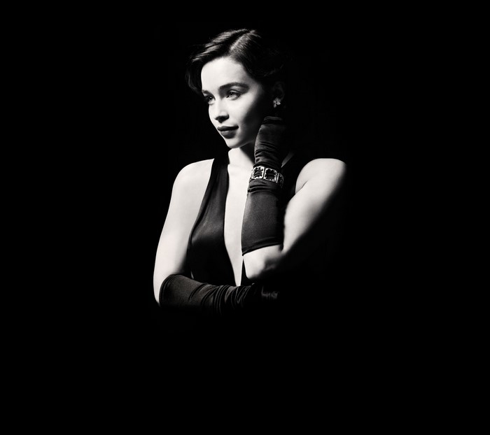 Emilia Clarke in black dress and gloves