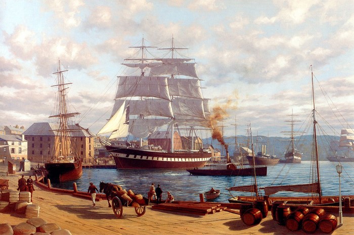 Historic Sailing Ships Docked at a Busy Harbor