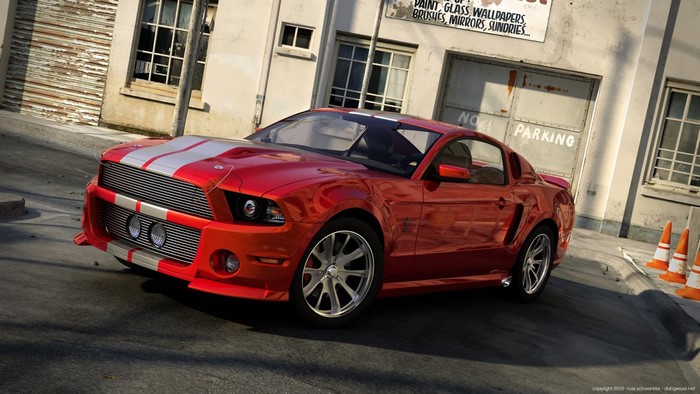Red Ford Mustang Shelby GT500 parked on street
