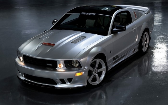 Silver SMS Ford Mustang parked on a wet floor