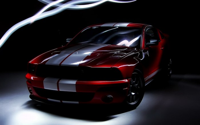 Red Ford Mustang Shelby GT500 with white stripes