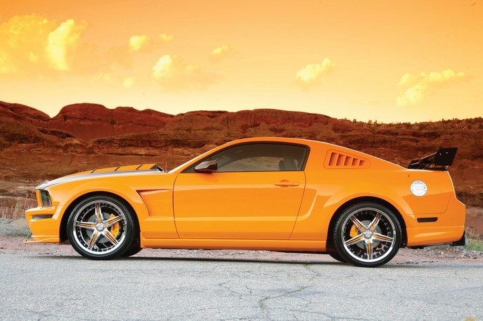 Orange Ford Mustang with Spoiler in Desert Landscape