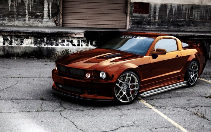 Custom Ford Mustang parked in an urban alley