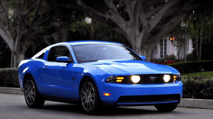 Blue Ford Mustang parked on a street