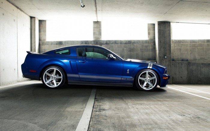 Blue Ford Shelby GT500 Mustang parked in a garage