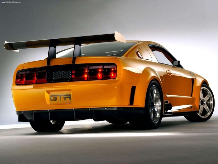 Orange Ford Mustang GTR with a large rear spoiler