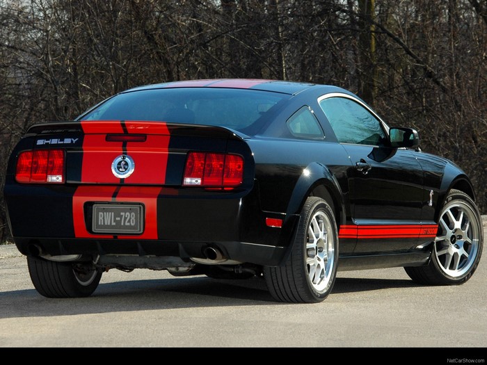 Black Shelby Mustang GT500 with red stripes