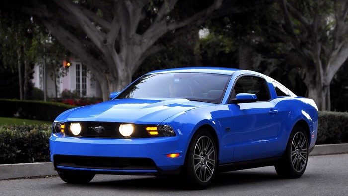 Blue Ford Mustang parked on a street