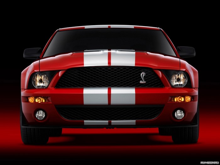 Red Ford Shelby Mustang GT500 with white stripes