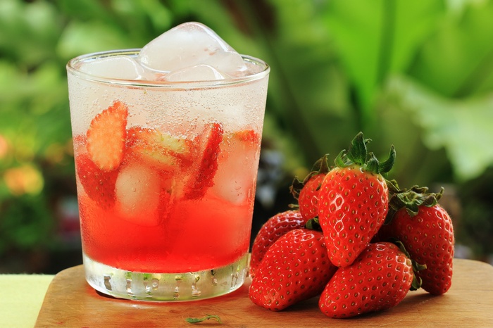 Strawberry drink with ice and fresh strawberries