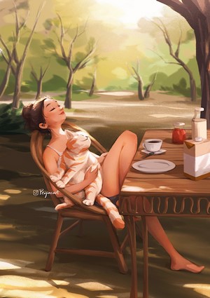 Woman holding a cat on a chair at a table