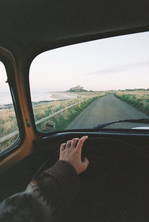 Driving towards a castle by the sea