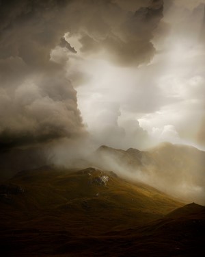 Misty mountains under stormy clouds in Iceland